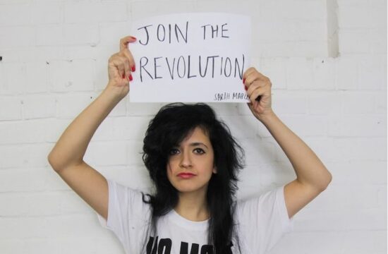 girl-holding-sign-join-the-revolution